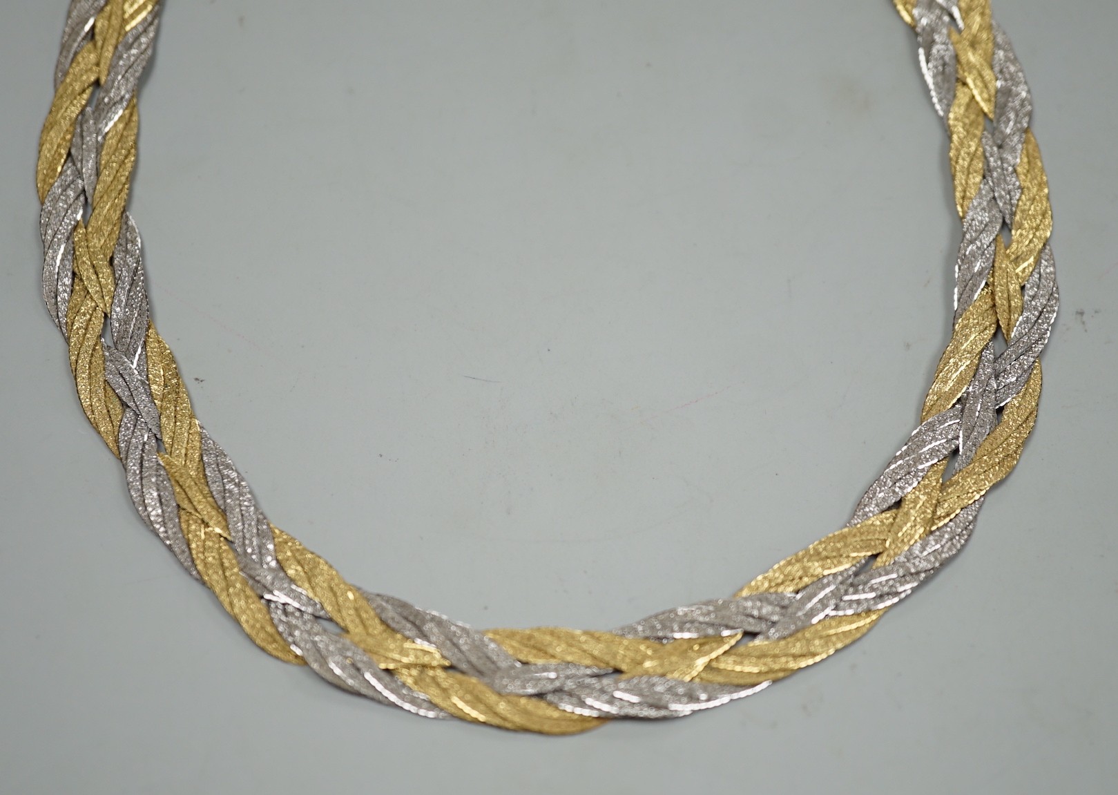 A modern Italian two colour 750 interwoven necklace, 38cm, 33.8 grams.